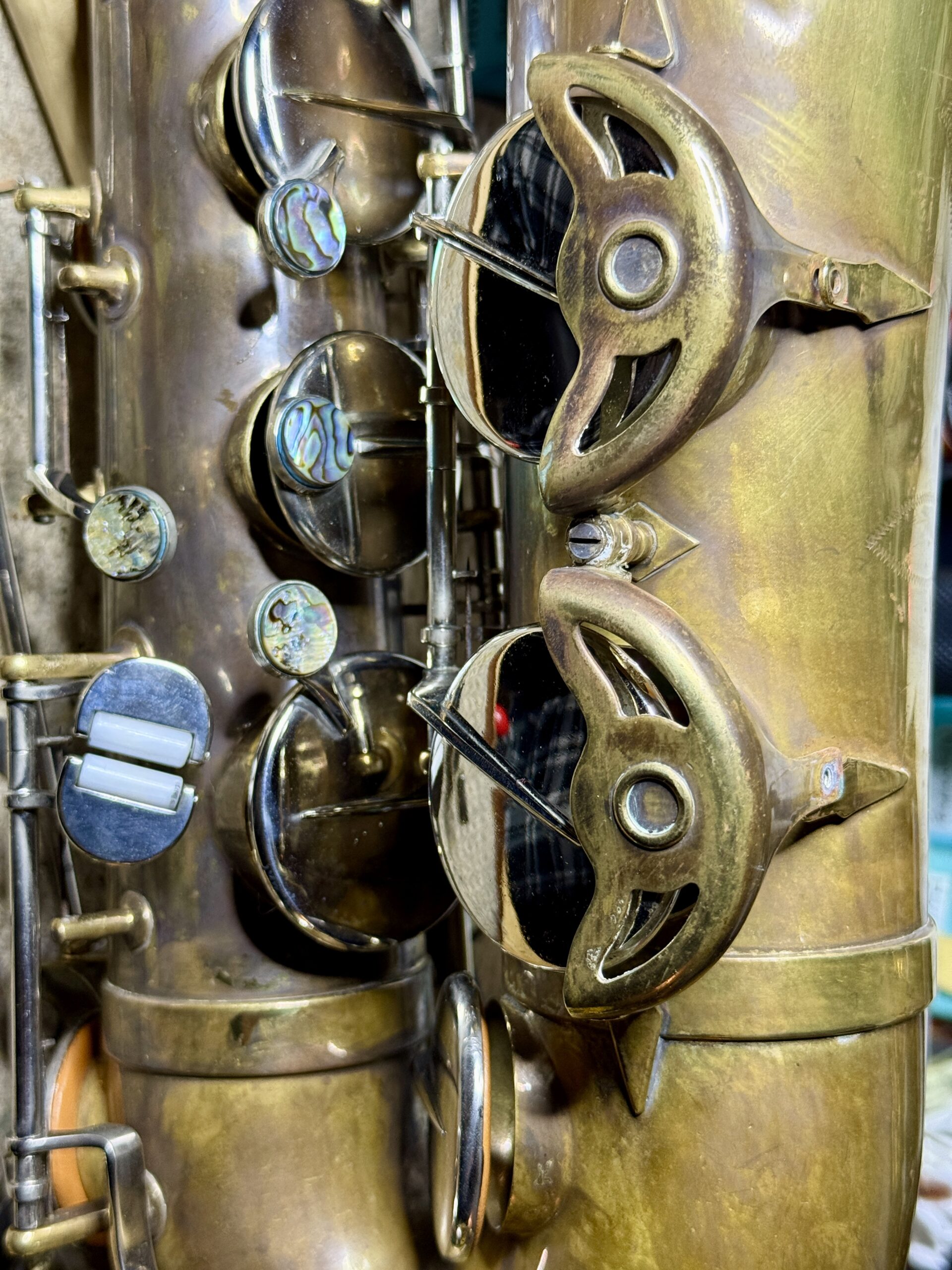 Raw brass with nickel keys and abalone key touches.